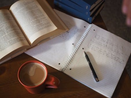 Pen, Notes, Book and Cup of Coffee