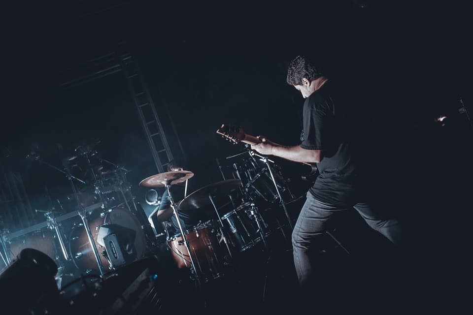 Man Playing Guitar on stage